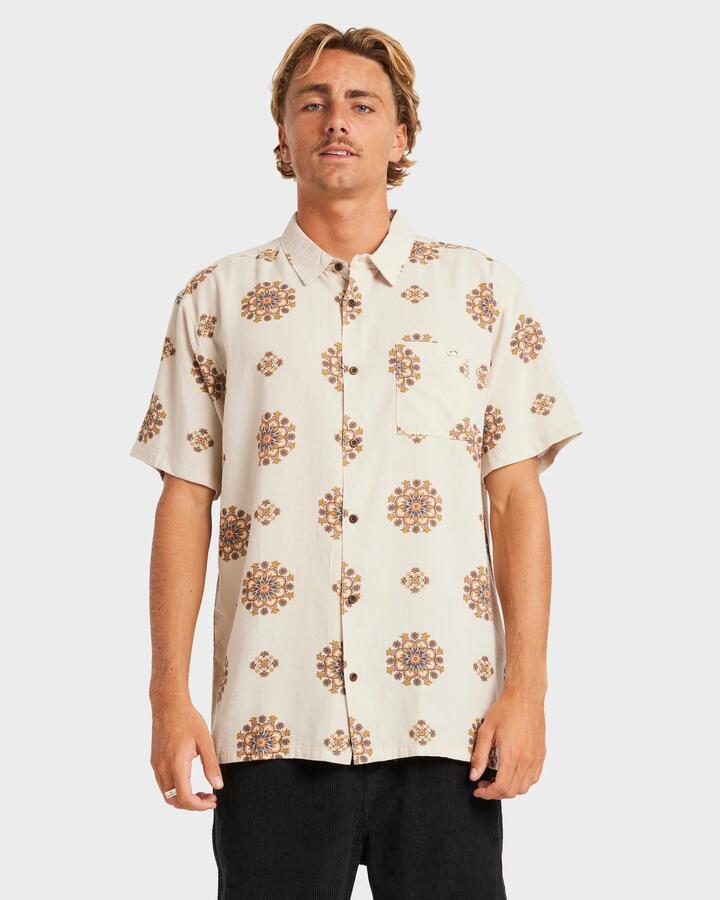 Image of a model wearing Tops. Product name - Billabong Mens Cordoba Short Sleeve Shirt Cream in Cream colour by brand - Billabong
