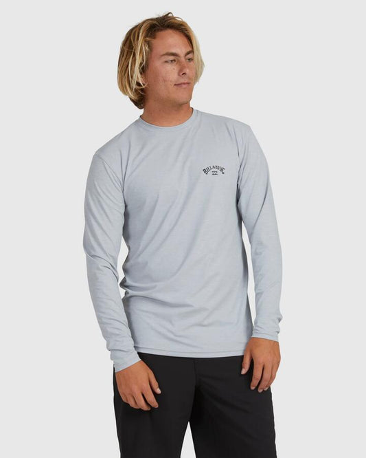 Image of a model wearing Tops. Product name - Billabong Mens Shoreline Upf 50 Long Sleeve Rashguard Light Grey Heather in Light Grey Heather colour by brand - Billabong
