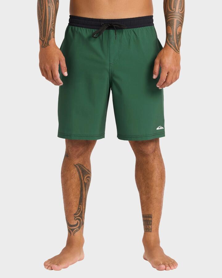 Image of a model wearing Shorts. Product name - Quiksilver Mens Pu-Tawhiro 20" Swim Shorts Jungle Green in Jungle Green colour by brand - Quiksilver