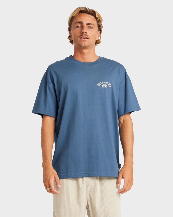 Image of a model wearing Tops. Productname: Billabong - Mens Heritage Arch T-Shirt - Real Teal - in Real Teal colour by brand - Billabong