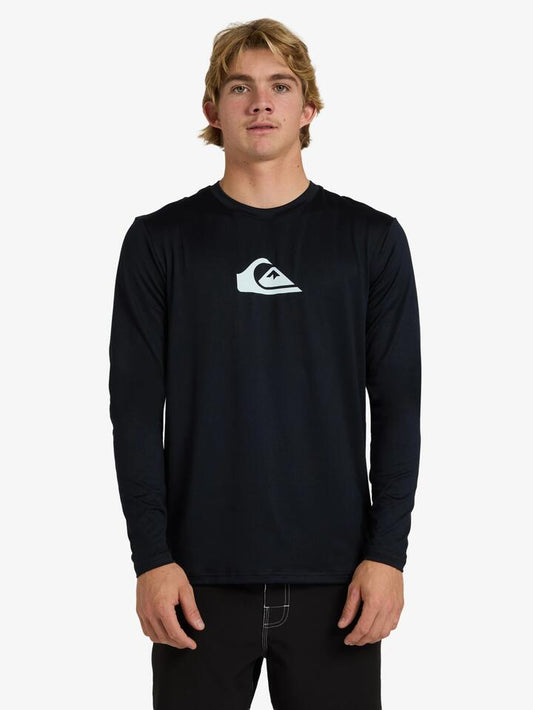 Image of a model wearing Tops. Productname: Quiksilver - Mens Solid Streak Long Sleeve Surf Shirt - Black - in Black colour by brand - Quiksilver