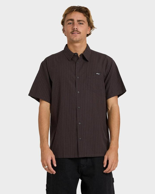 Image of a model wearing Tops. Productname: Billabong - Mens Mogul Short Sleeve Shirt - Raven - in Raven colour by brand - Billabong