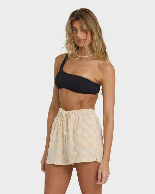 Image of a model wearing Shorts. Productname: Billabong - Womens Laura Waves High Waist Shorts - Antique White - in Antique White colour by brand - Billabong