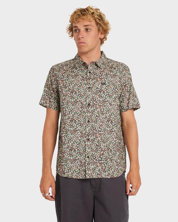 Image of a model wearing Tops. Product name - RVCA Mens Heavy Bloom Short Sleeve Shirt Black in Black colour by brand - RVCA