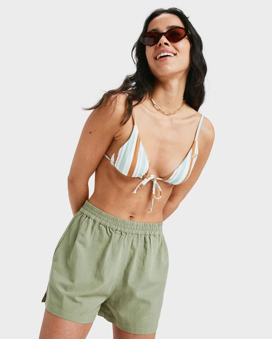 Image of a model wearing Shorts. Product name - Roxy Womens Lekeitio Bay Ii Elastic Waist Shorts Oil Green in Oil Green colour by brand - Roxy
