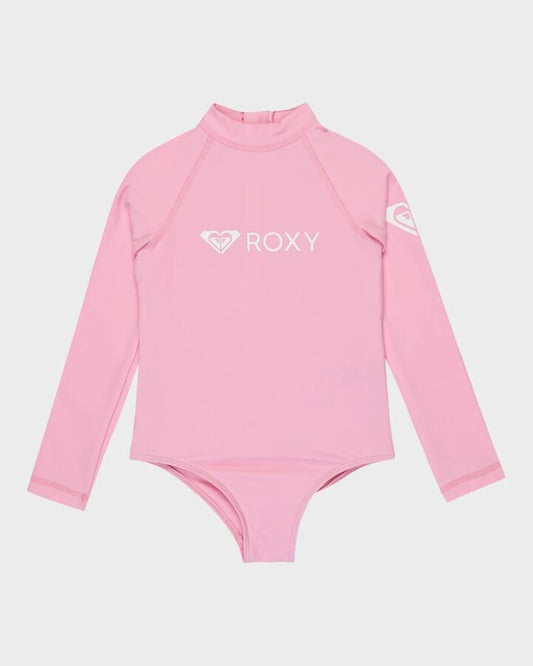 Image of a model wearing Tops. Product name - Roxy Girls 2-7 Heater Long Sleeve One Piece Rash Vest Bonbon in Bonbon colour by brand - Roxy