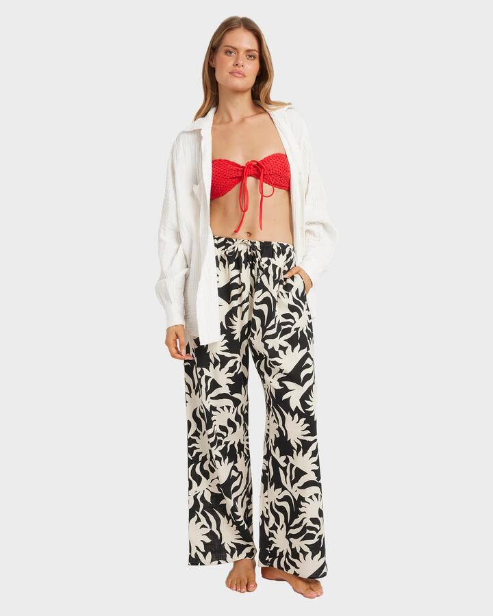 Image of a model wearing Pants. Product name - Billabong Womens By My Side Elastic Waist Pants Black White in Black White colour by brand - Billabong