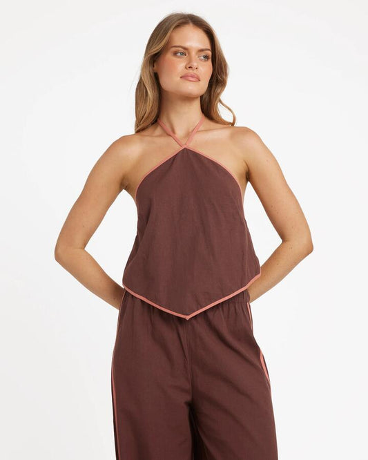 Image of a model wearing Tops. Productname: Billabong Womens Coastal Crush Crop Halter Top Teak - in Teak colour by brand - Billabong