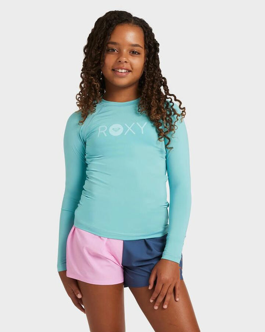 Image of a model wearing Tops. Productname: Roxy Girls 8-16 Essential Long Sleeve Rash Vest Coastal Shade - in Coastal Shade colour by brand - Roxy