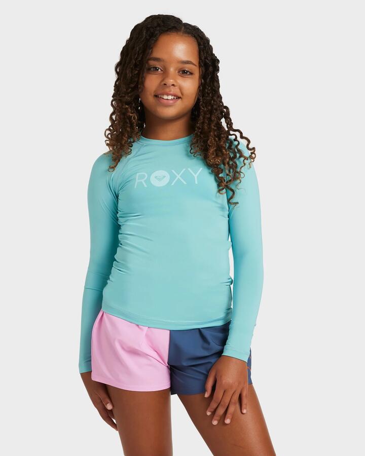 Image of a model wearing Tops. Product name - Roxy Girls 8-16 Essential Long Sleeve Rash Vest Coastal Shade in Coastal Shade colour by brand - Roxy
