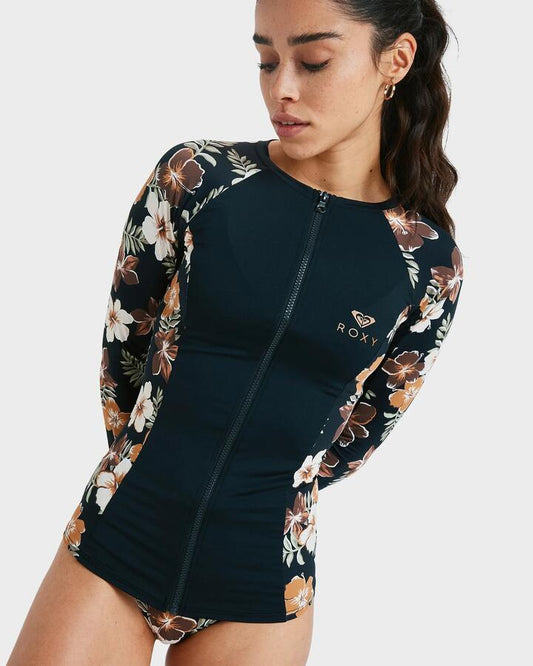 Image of a model wearing Tops. Product name - Roxy Womens Full Zipped Mix Long Sleeve Rash Vest Almond Tropical Feels in Almond Tropical Feels colour by brand - Roxy
