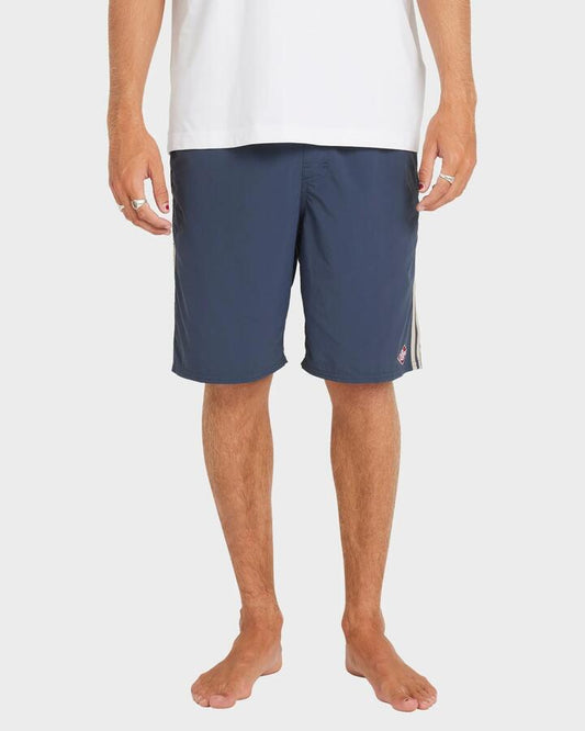 Image of a model wearing Shorts. Productname: RVCA - Mens Breakout Elastic 20" Trunks - Moody Blue - in Moody Blue colour by brand - RVCA