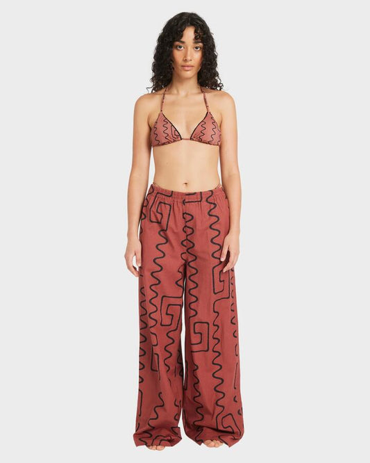 Image of a model wearing Pants. Product name - RVCA Womens Farlow Elastic Elastic Waist Pants Mahogany in Mahogany colour by brand - RVCA