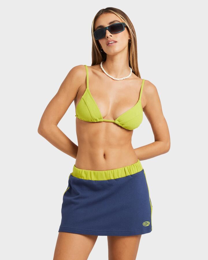 Image of a model wearing Skirts. Product name - Billabong Womens Billa Crush Mini Skirt Celestial Blue in Celestial Blue colour by brand - Billabong
