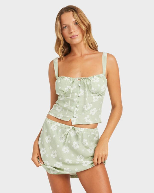 Image of a model wearing Skirts. Productname: Roxy - Womens Blossom Bias Mini Skirt - Sage - in Sage colour by brand - Roxy
