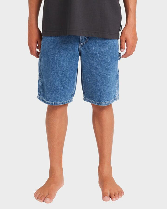 Image of a model wearing Shorts. Product name - Billabong Boys 8-16 Bad Dog Walkshorts Ocean Wash in Ocean Wash colour by brand - Billabong