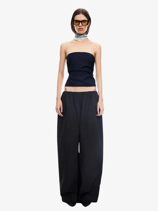 Image of a model wearing Pants. Productname: Lioness Tidekiss Pants in Noir colour by brand - Lioness