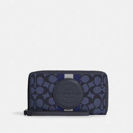 Image of Wallets & Money Clips. Productname: Dempsey Large Phone Wallet In Signature Jacquard With Stripe And Coach Patch in SV/DENIM/MIDNIGHT NAVY MULTI colour by brand - Coach Outlet Australia