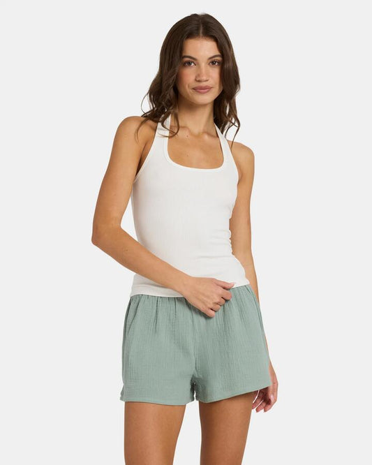 Image of a model wearing Tops. Product name - Nunui Womens New Moon Halter Top Off White in Off White colour by brand - Nunui