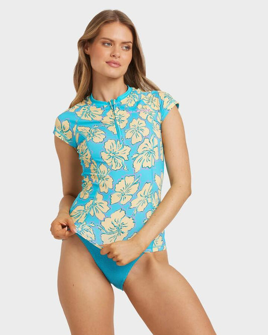 Image of a model wearing Tops. Productname: Billabong - Womens Tropic Shift Short Sleeve Rash Vest - Atlantis - in Atlantis colour by brand - Billabong