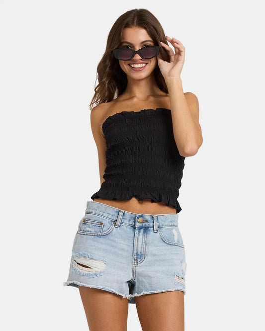 Image of a model wearing Tops. Productname: Nunui Womens Sundae Shirred Tube Tank Black - in Black colour by brand - Nunui