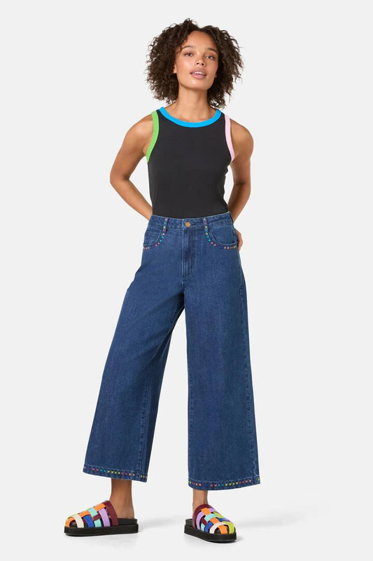 Image of a model wearing Skirts. Product name - Atrium Embroidered Denim Culot in Denim colour by brand - Gorman
