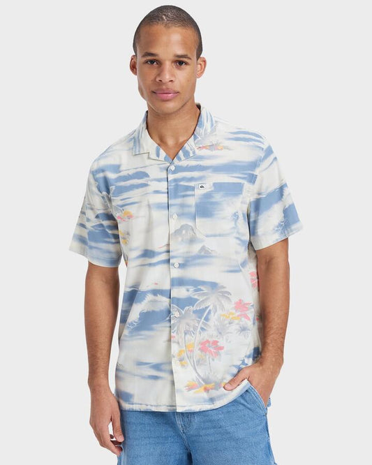 Image of a model wearing Tops. Product name - Quiksilver Mens Beach Club Short Sleeve Shirt Birch Tropical Surf 64 in Birch Tropical Surf 64 colour by brand - Quiksilver