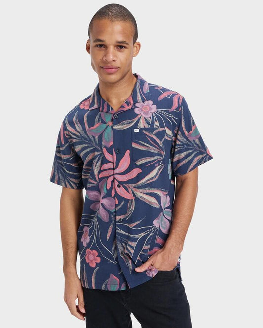 Image of a model wearing Tops. Productname: Quiksilver - Mens Beach Club Short Sleeve Shirt - Dark Navy Surrealism 64 - in Dark Navy Surrealism 64 colour by brand - Quiksilver