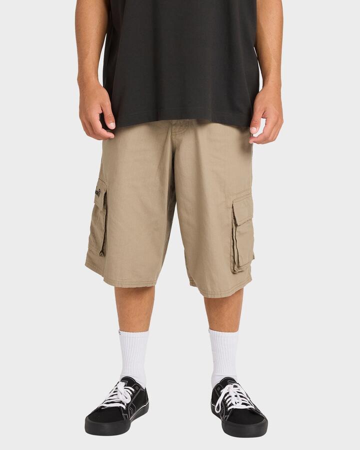 Image of a model wearing Shorts. Productname: Billabong - Mens Script Cargo Shorts - Khaki - in Khaki colour by brand - Billabong