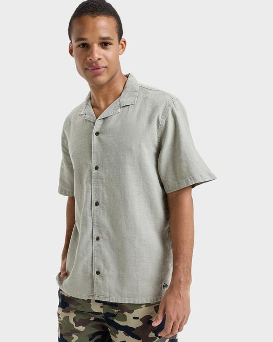Image of a model wearing Tops. Productname: Quiksilver - Mens Sunrise Short Sleeve Shirt - Seneca Rock - in Seneca Rock colour by brand - Quiksilver