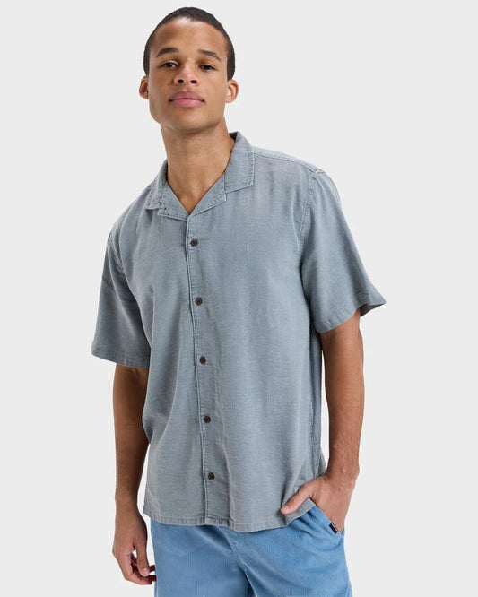 Image of a model wearing Tops. Productname: Quiksilver - Mens Sunrise Short Sleeve Shirt - Black - in Black colour by brand - Quiksilver