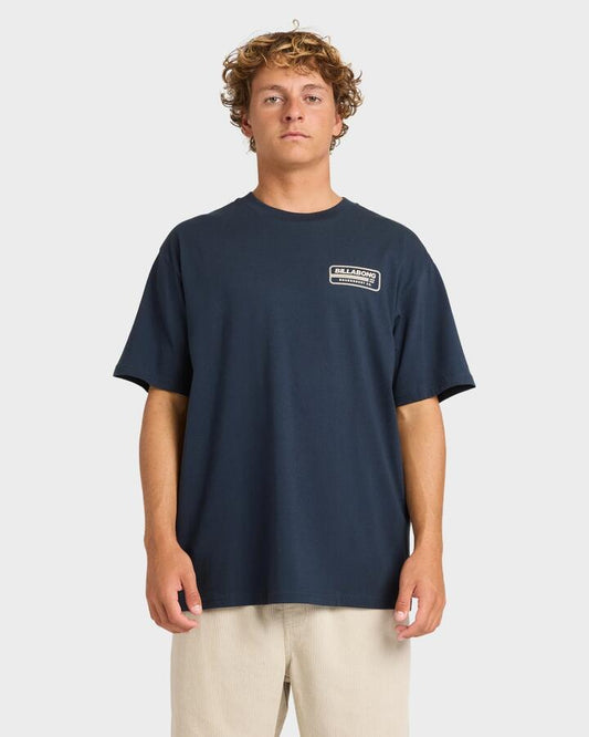 Image of a model wearing Tops. Productname: Billabong Mens Trademark T-Shirt Navy - in Navy colour by brand - Billabong