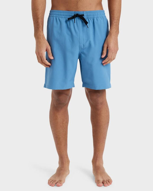 Image of a model wearing Shorts. Productname: Quiksilver Mens Taxer Amphibian 18" Hybrid Shorts Coronet Blue - in Coronet Blue colour by brand - Quiksilver