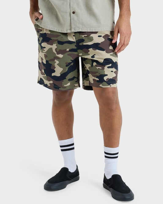 Image of a model wearing Shorts. Product name - Quiksilver Mens Taxer 18" Walkshorts Grape Leaf Impaired Camo in Grape Leaf Impaired Camo colour by brand - Quiksilver