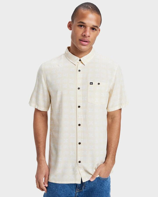 Image of a model wearing Tops. Productname: Quiksilver Mens Safe Paradise Short Sleeve Shirt Birch Etched In Stone 32 - in Birch Etched In Stone 32 colour by brand - Quiksilver