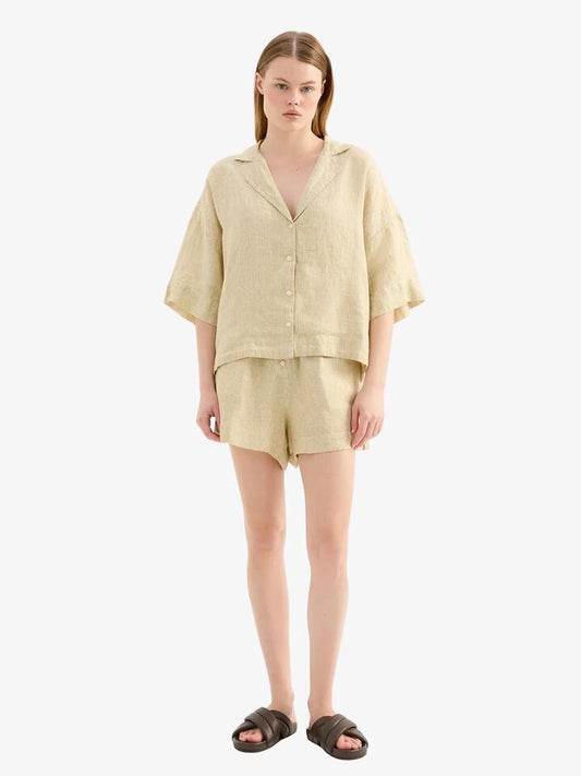 Image of a model wearing Shorts. Productname: Nude Lucy Lounge Stripe Linen Short in Moss Stripe colour by brand - Nude Lucy
