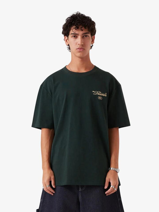 Image of a model wearing Tops. Productname: Barney Cools Day Time Dreamers Tee in Forest colour by brand - Barney Cools