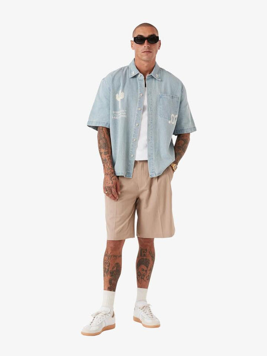 Image of a model wearing Denim. Productname: Zanerobe Design House Denim Shirt in Lt Blue colour by brand - Zanerobe