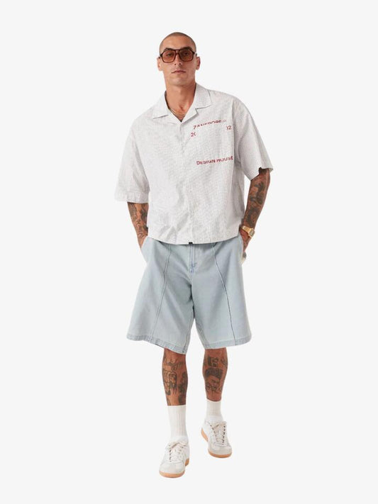 Image of a model wearing Tops. Productname: Zanerobe Overlap Crop Shirt in White Pinstripe colour by brand - Zanerobe