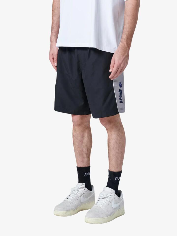 Image of a model wearing Shorts. Productname: Barney Cools Ace Shorts in Black colour by brand - Barney Cools