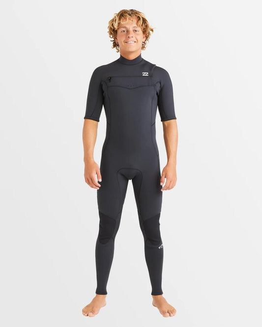 Image of a model wearing Tops. Productname: Billabong Mens 2/2Mm Absolute Natural Chest Zip Fullsuit Black - in Black colour by brand - Billabong