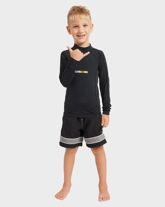 Image of a model wearing Tops. Product name - Billabong Boys 0-7 Spec 73 Performance Long Sleeve Rash Vest Black in Black colour by brand - Billabong