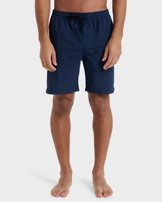 Image of a model wearing Shorts. Product name - Quiksilver Mens Taxer Amphibian 18" Hybrid Shorts Dark Navy in Dark Navy colour by brand - Quiksilver