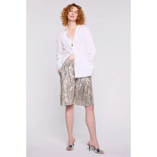 Image of a model wearing Tops. Productname: Kali Long Shirt in White colour by brand - sass and bide