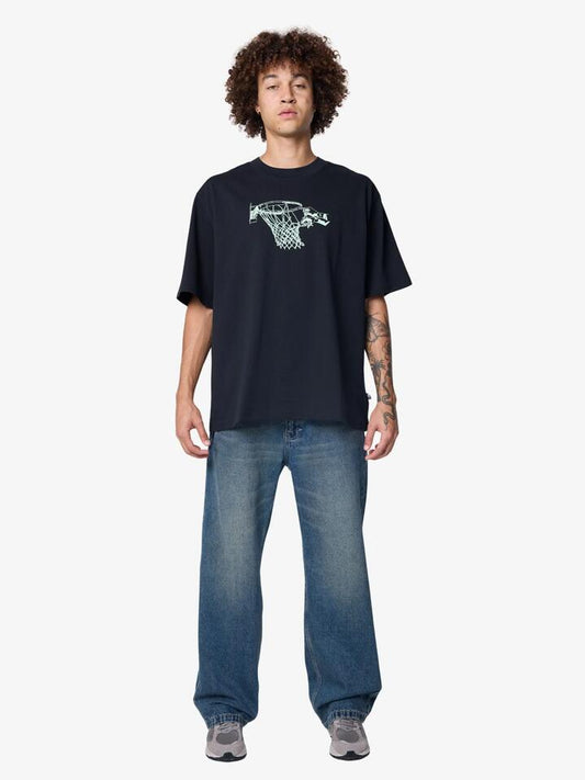 Image of a model wearing Tops. Productname: New Balance Hoops Tradition Graphic T-Shirt in Black colour by brand - New Balance