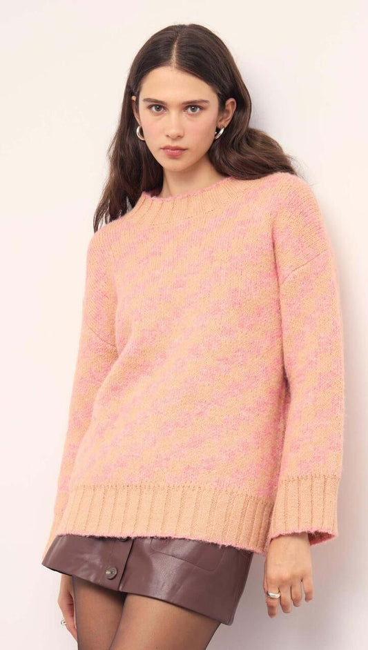 Image of a model wearing Outerwear. Product name - Pink Contrast Chunky Knit Jumper in Soft Peach colour by brand - MINKPINK