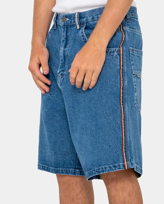 Image of a model wearing Shorts. Productname: rusty - Mens Flip Daddy 2.0 Denim Shorts - Middy Blue - in Middy Blue colour by brand - rusty