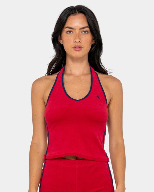 Image of a model wearing Tops. Productname: rusty - Womens Bodhi Toweling Halter Neck Tank Top - Red - in Red colour by brand - rusty