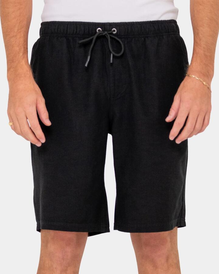 Image of a model wearing Shorts. Product name - Rusty Mens Overtone 20" Walkshorts Black in Black colour by brand - Rusty