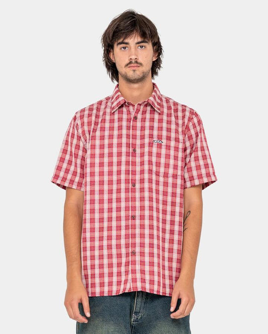 Image of a model wearing Tops. Productname: rusty - Mens Datsun Check Short Sleeve Shirt - Red - in Red colour by brand - rusty